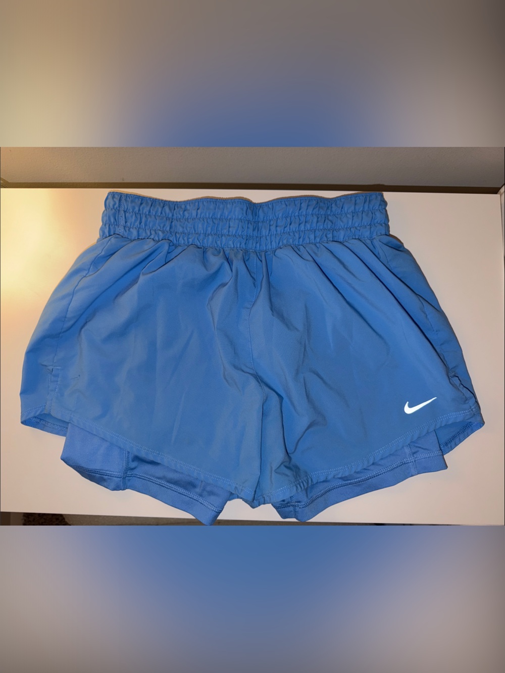 Nike Women’s Blue Athletic Running Shorts with White Swoosh